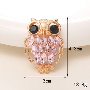 Golden owl brooch with pink crystals and black eyes, dimensions 4.3cm x 3cm