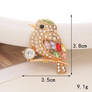 Detailed view of crystal bird charm showing 3.8cm height and colorful rhinestone inlay