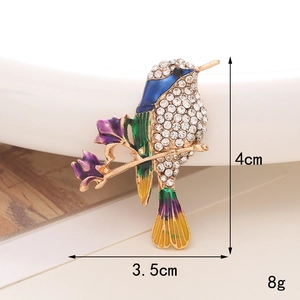 Detailed view of colorful enamel hummingbird brooch with dimensions 4cm x 3.5cm and 8g weight