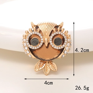 Exquisite golden owl brooch with amber gemstone and sparkling rhinestone eyes