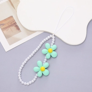 Detail of white faux pearl phone strap with mint green frosted flower charms