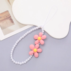 Detail of white beaded phone wrist strap with 3D pink flowers and smooth matte finish
