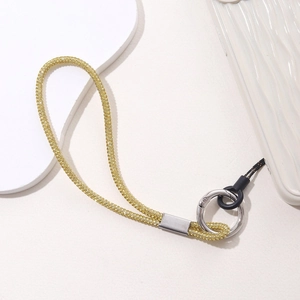 Close-up of luxury gold rhinestone phone wrist strap with metal spring ring and attachment