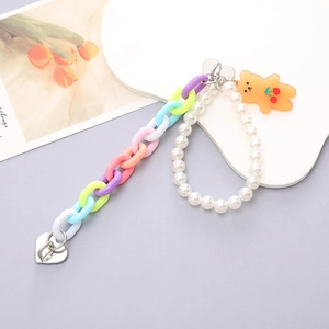 Colorful acrylic phone chain featuring pearl accents and a translucent orange bear charm