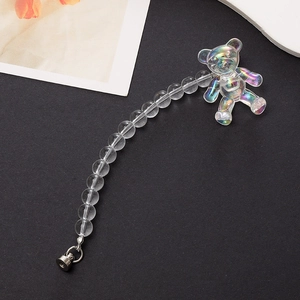 Detail of aurora acrylic beaded strap with iridescent 3D bear pendant and metal screw clasp