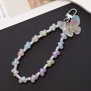 Detail of beaded keychain with laser acrylic butterfly pendant and macaron heart beads