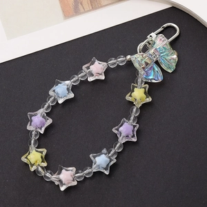 Acrylic iridescent bow keychain with colorful star beads and silver spring clasp