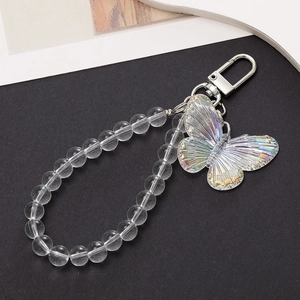 Macro view of holographic butterfly pendant with clear beads and silver spring clasp