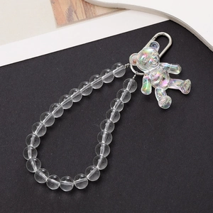 Detail of acrylic clear beaded keychain with holographic bear pendant and silver clasp