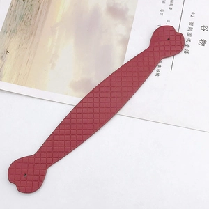 Detail of red checkered leather heart hand strap for DIY phone cases and bags