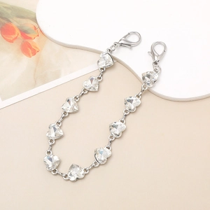 Detail of silver link chain featuring heart-shaped crystals and dual lobster clasps