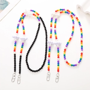 Detail of colorful cloud beaded phone charms with imitation pearls and lobster clasps