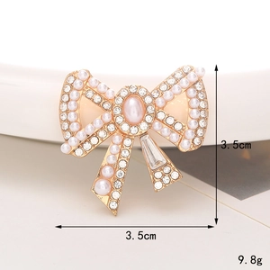 Élégante broche nœud en alliage doré avec perles blanches et strass brillants 3,5 cm