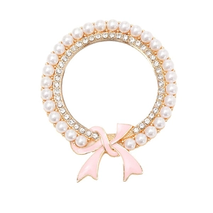 Eleganter goldener Perlen-Brosche mit rosa Emaille-Schleife und funkelnden Strass-Details