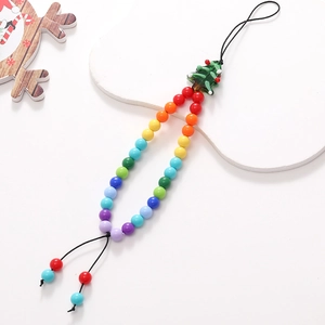 Detail view of colorful beaded phone strap with a festive green Christmas tree pendant