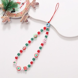 Detail of Christmas beaded phone strap with Santa, snowman and tree charms on white base