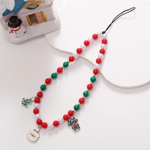 Detailed view of Christmas phone strap with Santa, reindeer and tree alloy pendants
