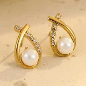 Elegant gold cross design earrings with sparkling diamonds and white pearls