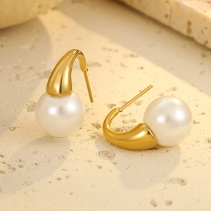 Elegant gold stainless steel pearl drop earrings with minimalist curved design and white pearls