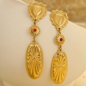 Bohemian gold heart and red bead statement earrings with vintage textured pendants