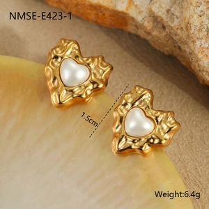 Detail of irregular molten gold heart earrings with white pearls and size markings