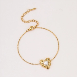 Detail of irregular lava heart pendant with white pearl on fine gold chain necklace