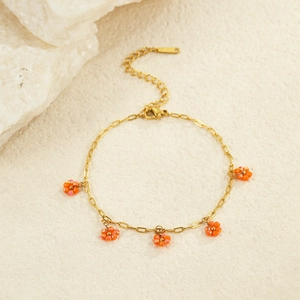 Gold chain bracelet with orange beaded flower charms and lobster clasp for women