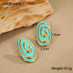 Detail view of oval gold spiral earrings with green enamel and 3.5cm size markings