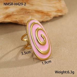 Detail view of pink enamel spiral ring with golden texture and dimensions 3.5cm by 1.9cm