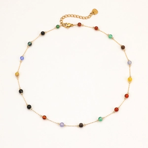 Close-up of 18K gold plated stainless steel necklace with colorful round beads and extender