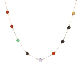 Colorful beaded gold chain necklace with red green and purple beads in a U-shaped layout