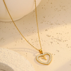 Detail of 18K gold-plated heart pendant with letter Y and zircon inlay for women