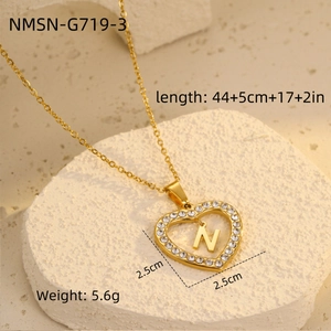 Macro shot of gold heart necklace with zircon N letter showing 2.5cm pendant dimensions