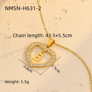 Close-up of 18K gold heart pendant with zircon letter B and adjustable chain dimensions