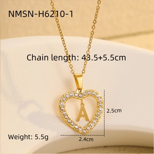 Detail of 18K gold plated heart pendant necklace with Zircon inlay and letter A