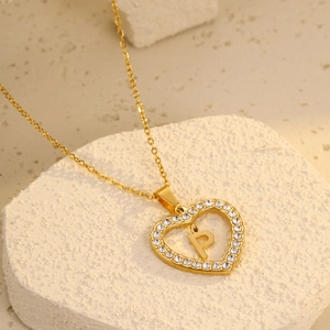 Close-up of 18K gold-plated heart pendant with letter P and sparkling zircon stones