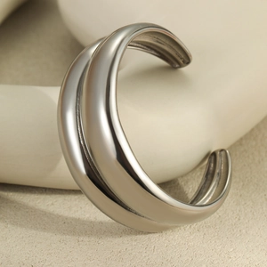 Minimalist double-layered silver stainless steel cuff bracelet with a polished mirror finish