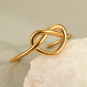 Minimalist 18K gold plated stainless steel open bangle with heart knot design