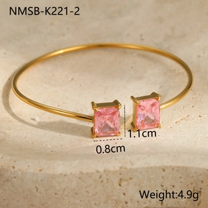 Detail of 18K gold plated stainless steel bangle with pink rectangular zircon stones