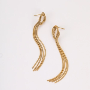 Detail shot of golden tassel earrings with woven knot and long round snake chains