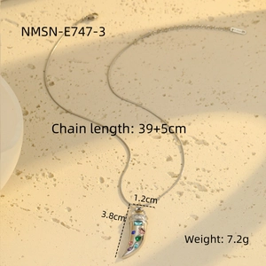 Macro shot of colorful zircon horn pendant with chain dimensions and weight details