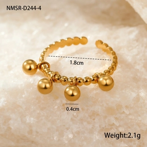 Macro shot of gold stainless steel open ring with 4mm ball charms and 18mm inner diameter