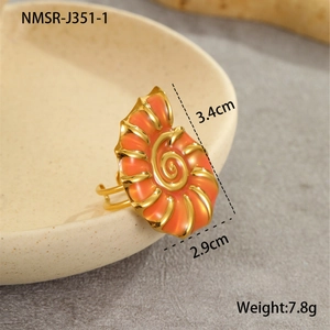 Detail view of 18K gold plated seashell ring with orange enamel and adjustable band size