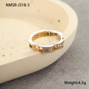 Detail shot of 0.5cm width two-tone titanium steel ring with silver and rose gold wave pattern