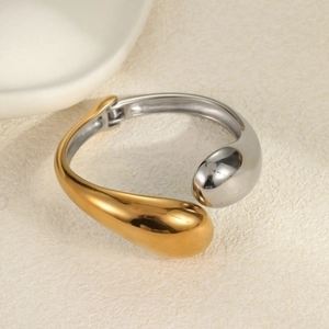 Minimalist bicolor teardrop open bangle in gold and silver finish with hinge closure