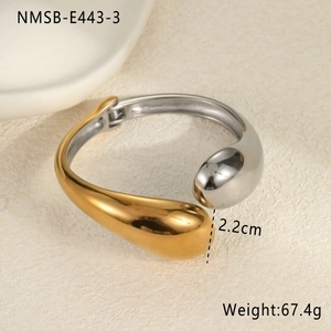Detailed view of bicolor teardrop metal bracelet with hinge closure and weight markings