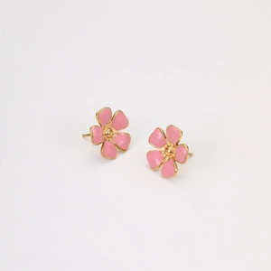 Detail shot of cute pink enamel flower stud earrings with gold plating for young girls