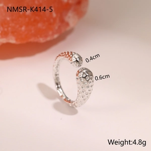 Detail view of the hammered texture and irregular wide band on the stainless steel ring
