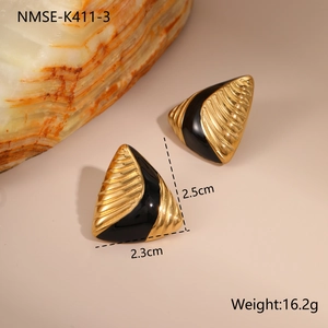 Detailed view of vintage gold triangle earrings with black enamel and linear texture