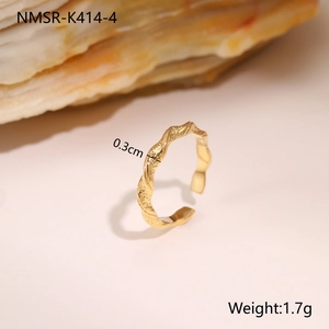 Macro shot of gold hammered ring texture with specifications of 0.3cm width and 1.7g weight